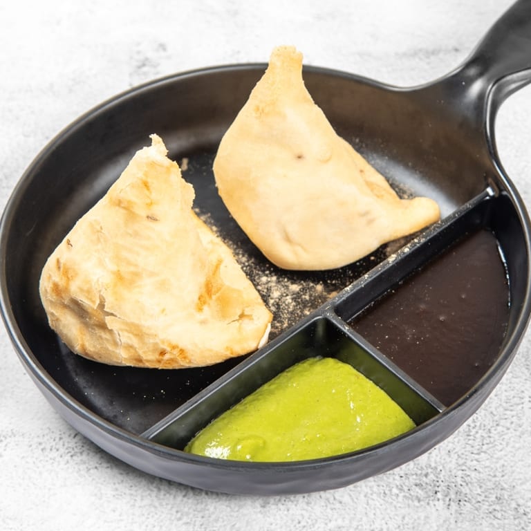 Savor Our Crispy Samosas